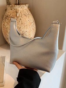 Minimalist silver grain leather tote bag with elegant shoulder strap for modern women