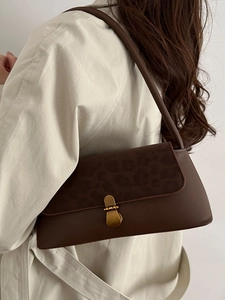 Vintage leopard print underarm bag with matte brown leather and gold buckle for women