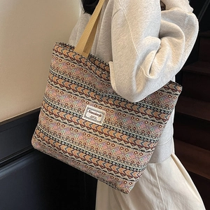 Ethnic woven tote bag with geometric patterns and shoulder straps for daily commute