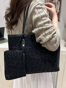 Leopard print tote bag set with matching pouch and golden stud details on shoulder straps