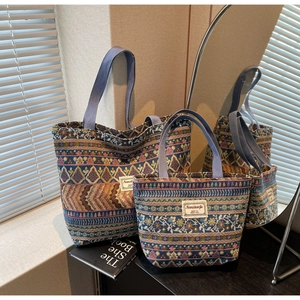 Detail of two-piece bohemian jacquard tote bags with vintage patterns and fabric handles