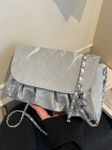 Silver pleated cloud shoulder bag with metallic chain and hollow sphere charm