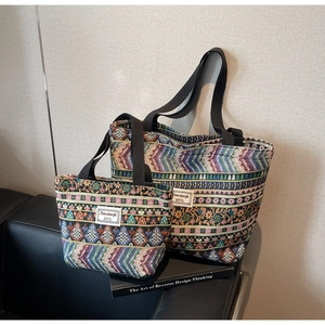 Close-up of bohemian jacquard tote bags with intricate geometric patterns and fabric handles