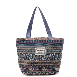 Ethnic bohemian woven tote bag with floral patterns and durable blue web handles
