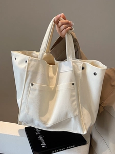 Minimalist creamy white corduroy tote bag with large capacity and exterior pocket