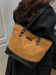 Brown and black quilted tote bag with diamond pattern and retro patchwork design