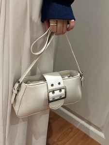 Chic beige faux leather underarm bag with silver buckle and shoulder strap