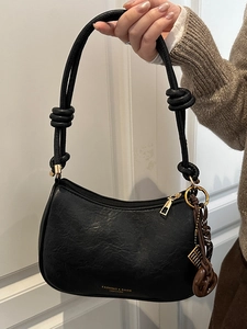 Sac bandoulière noir vintage en similicuir texturé avec détail de nœud décoratif