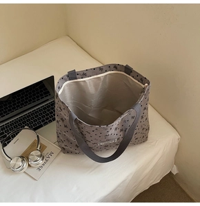 Top view of grey corduroy tote bag showing spacious interior and metal zipper pocket