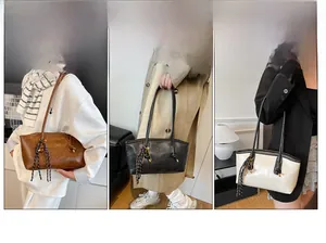 Detailed view of large capacity tote bag featuring stylish woven tassel accessory