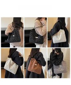 Detailed views of corduroy tote bags in four colors with braided rope shoulder straps