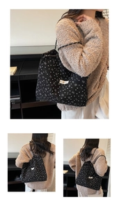 Detail showing patterned canvas tote bag with woven straps and heart bow prints