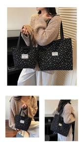 Detail of two-piece black canvas tote set with white heart and bow prints for women
