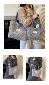 Detail of grey corduroy tote bag with black heart and bow prints in two sizes