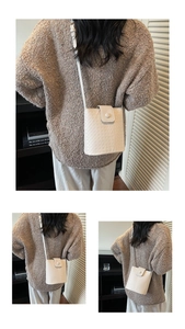 Detailed views of a white woven bucket bag with long crossbody strap on a model