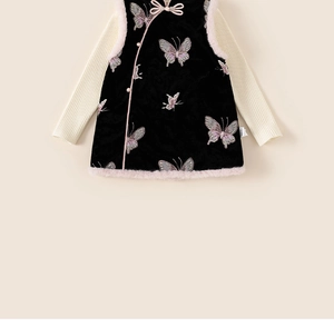 Close-up of girls Chinese style velvet vest with butterfly embroidery and knit base layer