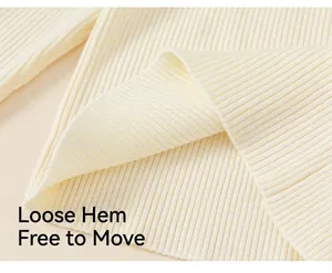 Close-up of rib-knit hem on cream girl's base shirt showing soft vertical texture