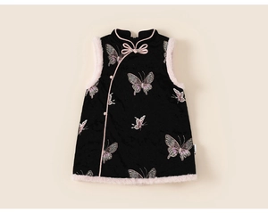 Detail of girls traditional Chinese vest with fur trim and pink butterfly embroidery