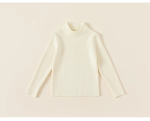 Detailed texture of off-white ribbed knit turtleneck sweater with warm ribbed fabric