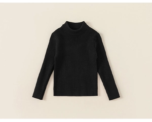 Detail of black ribbed knit turtleneck with elastic vertical stripe texture for kids