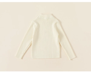 Detail of girls' cream knit sweater with vertical rib texture and semi-high collar