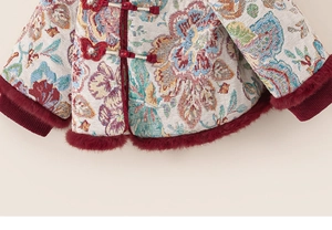 Close-up of traditional Chinese winter coat with floral brocade and red faux fur trim