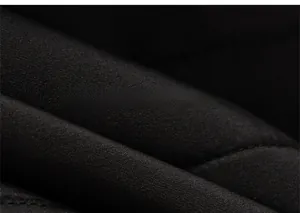 Close-up of black windproof fabric texture with durable stitching for winter set