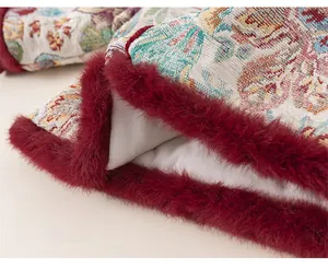 Detail of children's floral brocade jacket hem with plush deep red faux fur trim