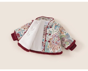 Detail of floral brocade Chinese New Year coat for girls with red faux fur trim