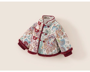 Detail of traditional floral jacquard jacket with butterfly knots and red faux fur trim
