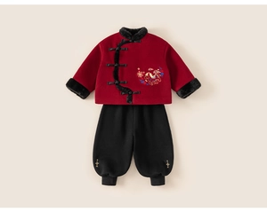 Detail of red Chinese New Year boy's suit with embroidery and faux fur trim