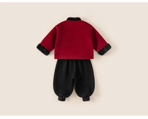 Detail of red Chinese style children top with black faux fur trim and elastic pants