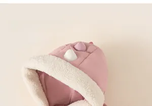 Detail of pink hooded jacket featuring soft white faux sheepskin lining and 3D ear accents