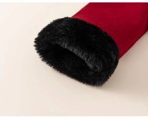 Detailed view of children's winter top featuring red fabric and plush black faux fur trim