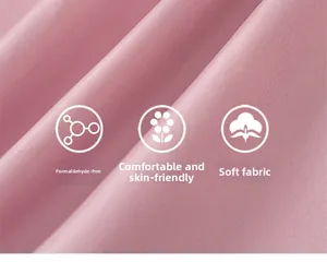 Macro detail of soft pink twill fabric showing smooth texture and skin-friendly fibers