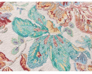 Close-up of traditional jacquard fabric featuring intricate floral patterns and textures