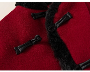Detail of traditional Chinese knot on red wool jacket with black faux fur trim