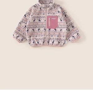 Detail of pink fleece baby jacket featuring festive reindeer and snowflake patterns