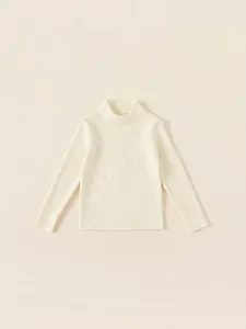 Girl's cream ribbed knit long sleeve sweater with a cozy mock neck for winter layering