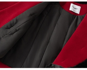 Detail of red wool jacket with black quilted lining and brand label on collar