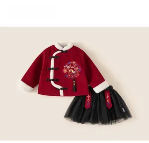 Detail of red velvet Chinese New Year top with embroidery and black tulle tutu skirt