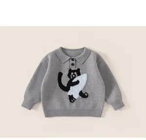 Detail of gray kids knit sweater with polo collar and black cat embroidery