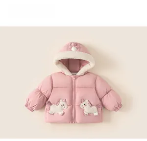 Detailed view of pink hooded winter coat for girls with cute unicorn patches and fleece lining