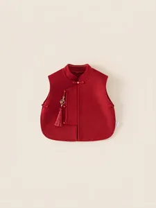 Traditional red Chinese New Year vest for girls with embroidery and golden tassels