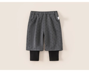 Detail of toddler polka dot layered pants with elastic waist and soft cotton texture