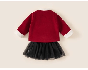 Detail of red winter top with white faux fur trim and layered black mesh tutu skirt