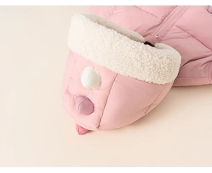 Close-up of pink quilted fabric and white sherpa fleece lining on child's hooded jacket
