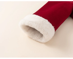 Detailed close-up of red velvet sleeve with thick white faux fur lining for winter outfit