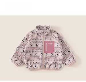 Detail of pink fleece jacket showing Fair Isle elk patterns and soft winter texture