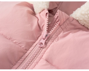 Close-up of pink quilted winter coat featuring white fleece collar and smooth resin zipper